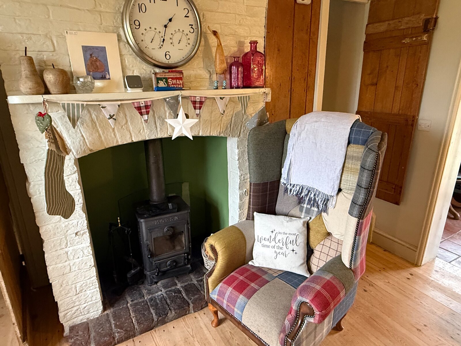 Christmas stockings above the cottage fireplace